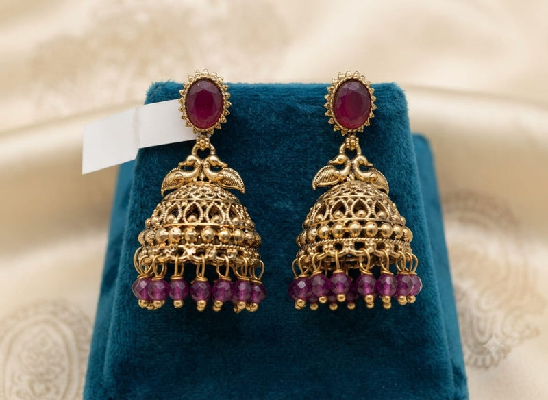 Antique Gold Dual Peacock Temple Jhumka Earrings with Oval Gemstone & Faceted Bead Drops